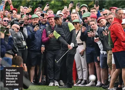  ?? ?? Popular: big crowds followed Woods in Ireland yesterday