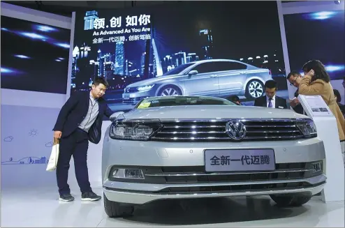  ?? PHOTOS PROVIDED TO CHINA DAILY ?? Volkswagen’s next-generation Magotan catches visitors’ eyes at an auto expo in Jinan, Shandong province.