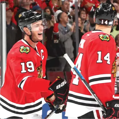  ?? | GETTY IMAGES ?? Jonathan Toews ( left) shares a laugh with Richard Panik after Toews ended his goal drought in the first period.