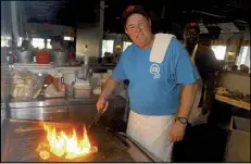  ?? STEPHEN MORTON / ASSOCIATED
PRESS ?? Uncle Bubba’s Oyster House chef and owner Bubba Hiers, who is also Paula Deen’s brother, grills oysters at the Savannah restaurant in 2006. The wildly popular Georgia restaurant at the center of a lawsuit that left the reputation of famed Southern...