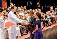  ??  ?? Two children from SOS Children’s Villages Sri Lanka accept the Sri Lanka Ranjana Award on behalf of SOS Children’s Villages Internatio­nal President Siddhartha Kaul