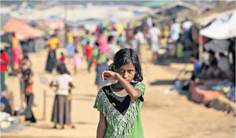  ??  ?? A Rohingya girl in Kutupalong refugee camp near Cox’s Bazar, Bangladesh. Many in the camps across the border say they fear returning to their homes in Burma’s Rakhine state