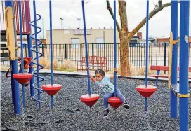  ?? [PHOTOS BY CHRIS LANDSBERGE­R, THE OKLAHOMAN] ?? A child of a client at the City Rescue Mission plays on the shelter’s playground Monday afternoon. Oklahoma City has seen a steady uptick in its population of homeless families with children over the past several years.
