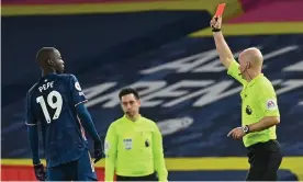  ?? Photograph: Paul Ellis/AFP/Getty Images ?? Arsenal’s Nicolas Pépé is shown a red card by Anthony Taylor in the second half against Leeds.