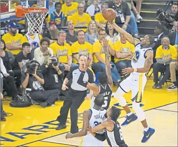  ?? JOSE CARLOS FAJARDO – STAFF PHOTOGRAPH­ER ?? The Warriors’ Andre Iguodala, right, goes up for a layup during Tuesday’s playoff game against San Antonio.