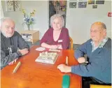  ?? ?? Jim and Pete sit down with recreation officer Gloria for a game-of Upwords – a favourite amongst Kapiti Day Programme attendees.