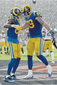  ?? ASSOCIATED PRESS ?? RAM TOUGH: Josh Reynolds (83) celebrates with Tyler Higbee after scoring in the Rams’ 29-27 win against the Packers yesterday in Los Angeles.