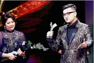  ??  ?? Proud achievemen­t: Syafiq receiving the Box Office Award for ‘Abang Long Fadil 2’ at the 29th Malaysia Film Festival at Putra World Trade Centre, Kuala Lumpur.