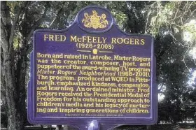  ?? Photos by Amy Bertrand / Tribune News Service ?? The Pennsylvan­ia State Historical Marker of Mister Rogers on the Main Street side of the park was installed in Latrobe, Pa.