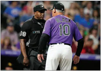  ?? DAVID ZALUBOWSKI / AP FILE (2022) ?? Colorado Rockies manager Bud Black argues with Moore during a game July 13, 2022, in Denver. When
Moore was a teen, he and his mother made the decision to pull the plug on livesaving efforts for his brother, who had been shot. “So when we talk about umpiring, and the pitch clock, and the pressure, about being in Yankee Stadium with a full-count on Aaron Judge in the ninth inning ... I’m numb to all that, because after going through what I went through, nothing fazes me. If I can get through that, everything else is a piece of cake,” he said.