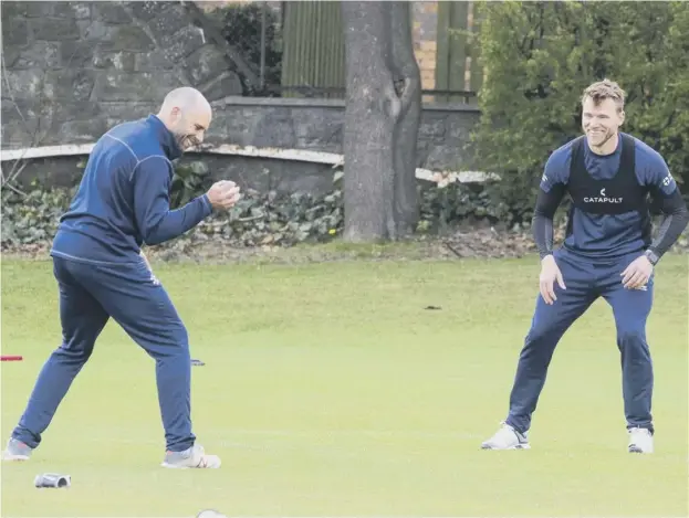  ??  ?? 0 Scotland's Kyle Coetzer and Richie Berrington are put through their paces by coach Shane Burger, inset below, at Goldenacre in Edinburgh ahead of the new season