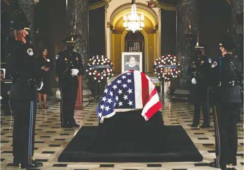  ?? Erin Schaf- Pool/ Gett y Imag es ?? The casket of Justice Ruth Bader Ginsburg lies in state at the U. S. Capitol during a memorial service on Friday.