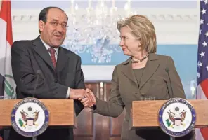  ?? HARAZ N. GHANBARI, AP ?? Secretary of State Hillary Clinton shakes hands with Iraqi Prime Minister Nouri al-Maliki after their meeting Oct. 19, 2009, at the State Department.