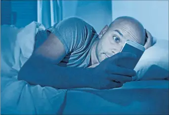  ?? PICTURE / FILE ?? BAD IDEA: Taking your phone to bed is not conducive to a good night’s sleep.