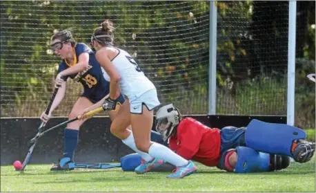  ?? PETE BANNAN — DIGITAL FIRST MEDIA ?? Notre Dame’s Maggie Pina, left, and goalie Paige Kieft combine to keep out a shot by Episcopal Academy’s Maddie Rehak Tuesday. Kieft, a freshman, made seven saves in a 2-1 Notre Dame win.
