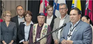  ?? ANDREW VAUGHAN/The Canadian Press ?? Perry Bellegarde, national chief of the Assembly of First Nations, addresses a news conference as Ontario Premier Kathleen Wynne, left, Yukon Premier Darrell Pasloski, B.C. Premier Christy Clark, Clement Chartier, president of Canada’s Metis National...