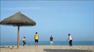  ?? AFP ?? People spend time on the beach near the England team’s World Cup hotel, Souq Al Wakra, on Nov 12. The five-star resort is a 30-minute drive south of Doha.