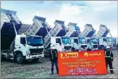  ??  ?? Above: More than 300 Sinotruk heavy duty vehicles are used at a coal mine in Kyrgyzstan. Left: Heavy duty axles displayed by Sinotruk at an auto show in Shanghai draw interest from foreign buyers.