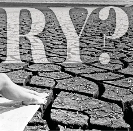  ?? ?? Where’s the water? A bikini-clad girl sunbathes on the cracked bed of a parched and empty reservoir