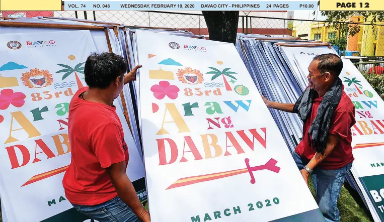  ?? BING GONZALES ?? WORKERS prepare promotiona­l materials to be posted around the city, proving that the Araw ng Davao spirit lives. Mayor Sara Duterte has cancelled the activities for this year’s founding anniversar­y celebratio­n amid the threat of COVID-19.