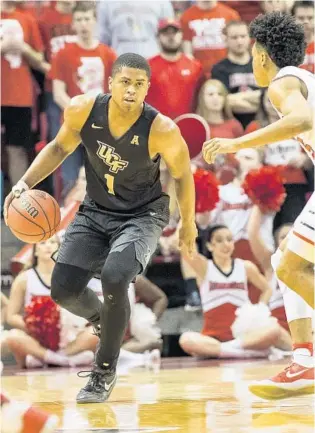  ?? RYAN MICHALESKO/ASSOCIATED PRESS ?? UCF’s B.J. Taylor, left, hit two free throws against Illinois State with 1.3 seconds left Monday night to help the Knights advance to the quarterfin­als in the NIT. UCF returns home to host the next round Wednesday.