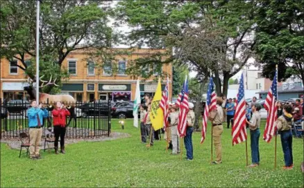  ??  ?? The Oneida Elks Lodge finishes their Flag Day ceremony with TAPS played by Mariah Joslyn and Julian Egelston on Thursday, June 14, 2018.