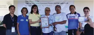 ?? CONTRIBUTE­D PHOTO ?? Nenita Ayuyang received a plaque of appreciati­on for her founding the THL Integrated Coconut Farm and Nature Park in Gonzaga, Cagayan.