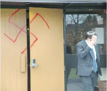  ?? WAYNE CUDDINGTON ?? Joshua Dougherty outside Congregati­on Machzikei Hadas, which had been vandalized overnight.