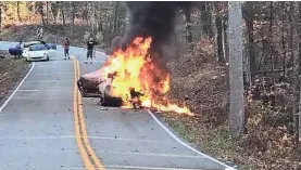  ??  ?? A 2017 Nissan GT-R burns Sunday on a stretch of U.S. Highway 129 known as “The Tail of the Dragon.” EDDIE BALL