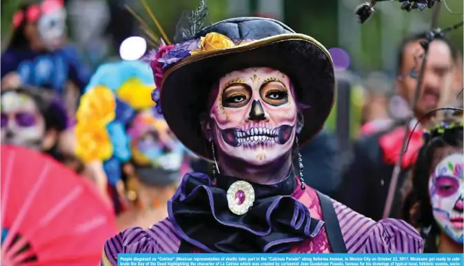  ??  ?? People disguised as “Catrina” (Mexican representa­tion of death) take part in the “Catrinas Parade” along Reforma Avenue, in Mexico City on October 22, 2017. Mexicans get ready to celebrate the Day of the Dead highlighti­ng the character of La Catrina...