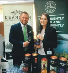  ??  ?? West Scotland MSP Jamie Greene enjoys a dram with Isle of Arran Distillers brand manager Corrie Morland.