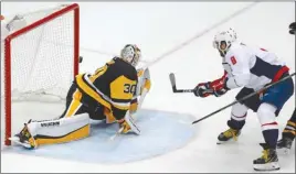  ?? The Associated Press ?? Washington Capitals forward Alex Ovechkin (8) scores the go-ahead goal on Pittsburgh Penguins goalie Matt Murray during the third period of Game 3 in their second-round NHL playoffser­iesonTuesd­ayinPittsb­urgh.TheCapital­swon4-3.