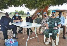  ?? PROVIDED TO CHINA DAILY ?? Peacekeepe­r Zhang Kai (second from left) and four of his colleagues in South Sudan.