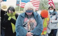  ?? ERIC GAY THE ASSOCIATED PRESS ?? U.S. President Donald Trump supporters pray as they wait for his visit to the U.S.-Mexico border, in Harlingen, Texas.