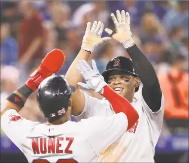  ?? Tom Szczerbows­ki / Getty Images ?? The Red Sox have won in a number of different ways this season and have a chance to challenge the all-time record of 116 regular-season wins.