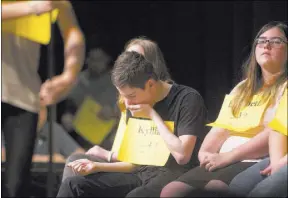  ?? ERIK VERDUZCO LAS VEGAS REVIEW-JOURNAL @ERIK_VERDUZCO ?? Kyllian Thorne, 14, center, waits for his turn in the Nevada State Spelling Bee on Saturday at Bishop Gorman High School.