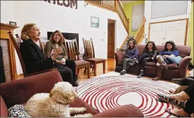  ?? ERIC ALBRECHT / COLUMBUS DISPATCH ?? Speaking to a small group of young adults in the living room of Michael and Laura Dattner, Trudy Blumenstei­n (left), accompanie­d by daughter Deborah Kramer, explained how her experience lingers with her today.