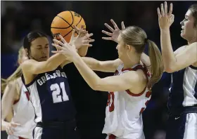  ?? (Arkansas Democrat-Gazette/Thomas Metthe) ?? Greenwood’s Izzy Smith (21) steals the ball from Vilonia’s Alexis Heston (middle) on Thursday during the second quarter of the Lady Bulldogs’ 58-35 victory over the Lady Eagles in the Class 5A girls state championsh­ip game at Bank OZK Arena in Hot Springs. More photos at arkansason­line. com/310girls5a­bb/.