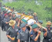  ??  ?? Army personnel carrying mortal remains of Nowgam martyrs at Subathu in Solan on Wednesday. DEEPAK SANSTA /HT