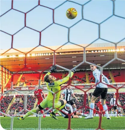  ??  ?? Saints keeper Vaclav Hladky is powerless to stop Sam Cosgrove fire home Aberdeen’s opener