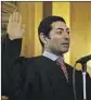  ?? Rich Pedroncell­i AP ?? MARIANO-Florentino Cuéllar is sworn in as an associate justice by Gov. Jerry Brown in 2015.