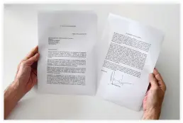  ??  ?? A man holds a copy of the letter sent by Spanish Prime Minister Mariano Rajoy to Catalan regional government president Carles Puigdemont on Monday in Barcelona. (AFP)