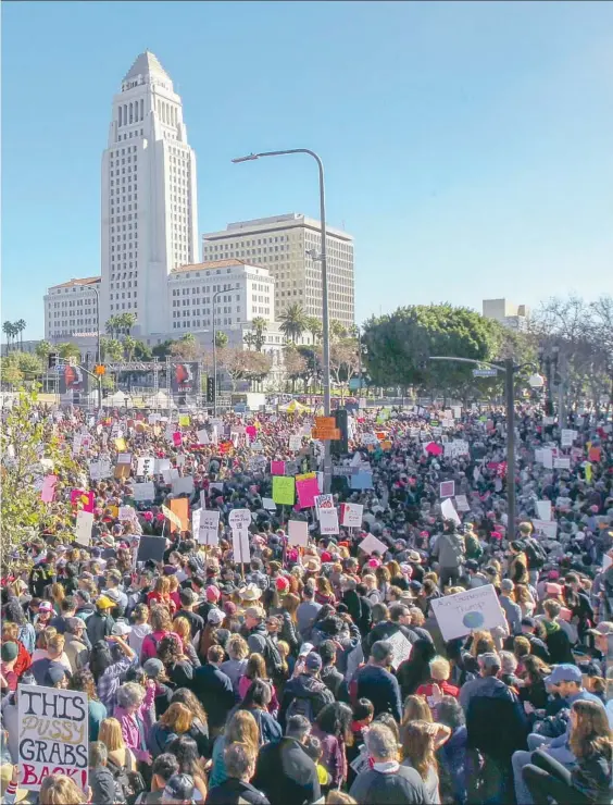  ?? Irfan Khan Los Angeles Times ?? for a women’s march. Hundreds of thousands of demonstrat­ors also f locked to the National Mall in Washington in a sea of pink hats, the symbol adopted by many women.