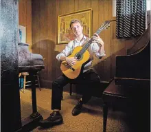  ?? JULIE JOCSAK TORSTAR ?? Evan Dim is studying classical guitar at a prestigiou­s school in Scotland. Earlier this year, he performed there for Prince Charles.