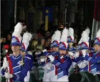  ?? FRAN MAYE - DIGITAL FIRST MEDIA ?? The Octorara High School Marching Band performs in the West Chester Christmas Parade Friday night.