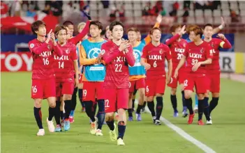  ?? — Reuters ?? Kashima Antlers players applaud fans after the Asian Champions League final first-leg match against Persepolis FC in Kashima, Japan, on November 3.
