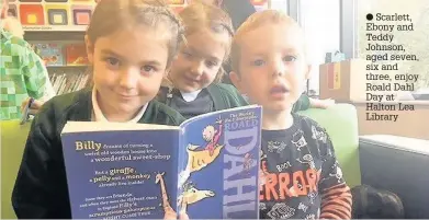  ??  ?? Scarlett, Ebony and Teddy Johnson, aged seven, six and three, enjoy Roald Dahl Day at Halton Lea Library