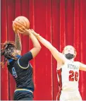  ?? VINCENT D. JOHNSON / DAILY SOUTHTOWN ?? Marist’s Mary Clare Brusek tries to block a shot by Simeon’s Jayla White on Monday.