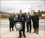  ?? TY GREENLEES / STAFF ?? State Rep. Jim Butler (R-Oakwood, at podium) and Rep. Fred Strahorn (D-Dayton, left) held a press conference recently with civic leaders to address the preservati­on of Good Samaritan Hospital and other hospital facilities for essential citizen access.