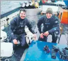  ??  ?? Divers Stef Cooper, left, and Alin Burlan with the rescued sheep.